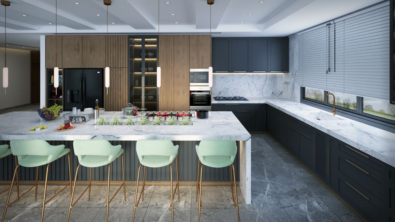 Spacious modern kitchen featuring marble countertops, mint green bar stools, and elegant pendant lighting.